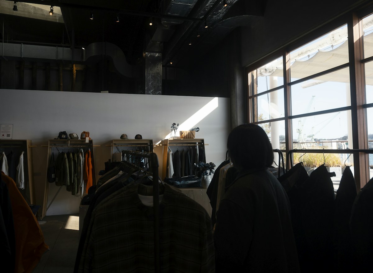 Interior of a clothing boutique with racks of garments